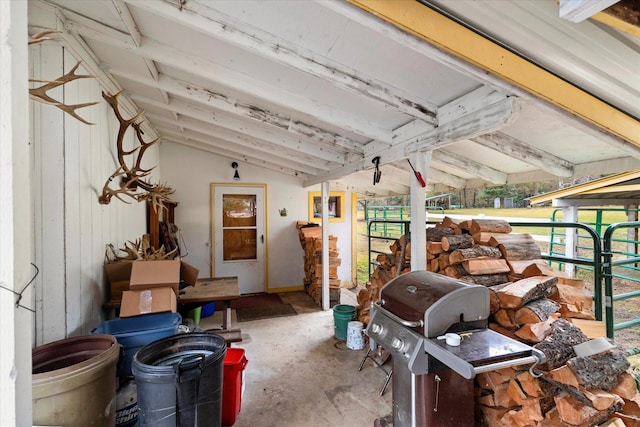 view of patio with an outbuilding and a grill