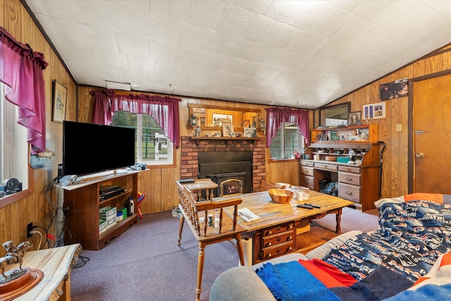 carpeted living room with wooden walls and lofted ceiling