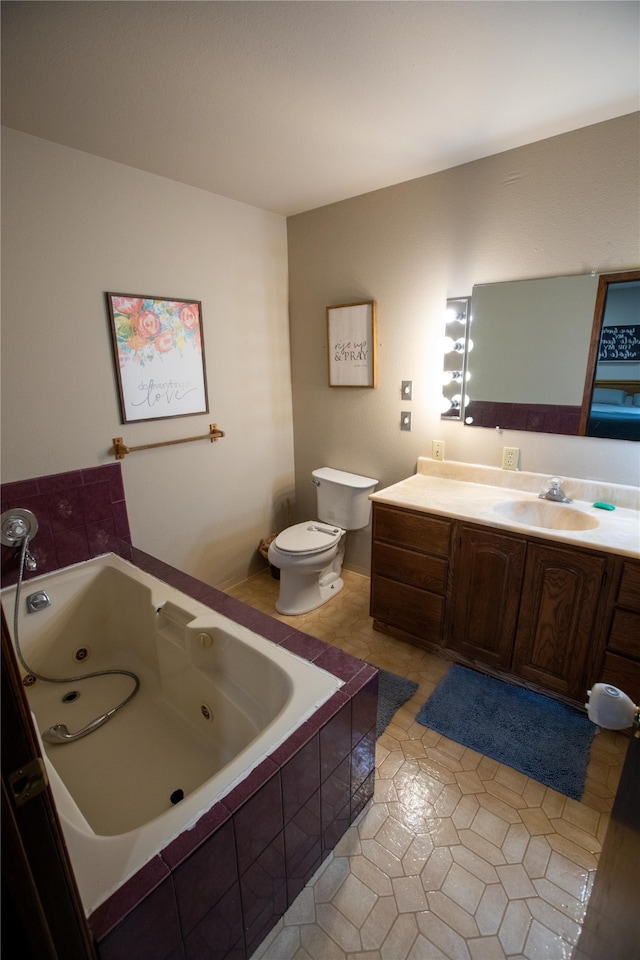 bathroom featuring a relaxing tiled bath, vanity, tile floors, and toilet