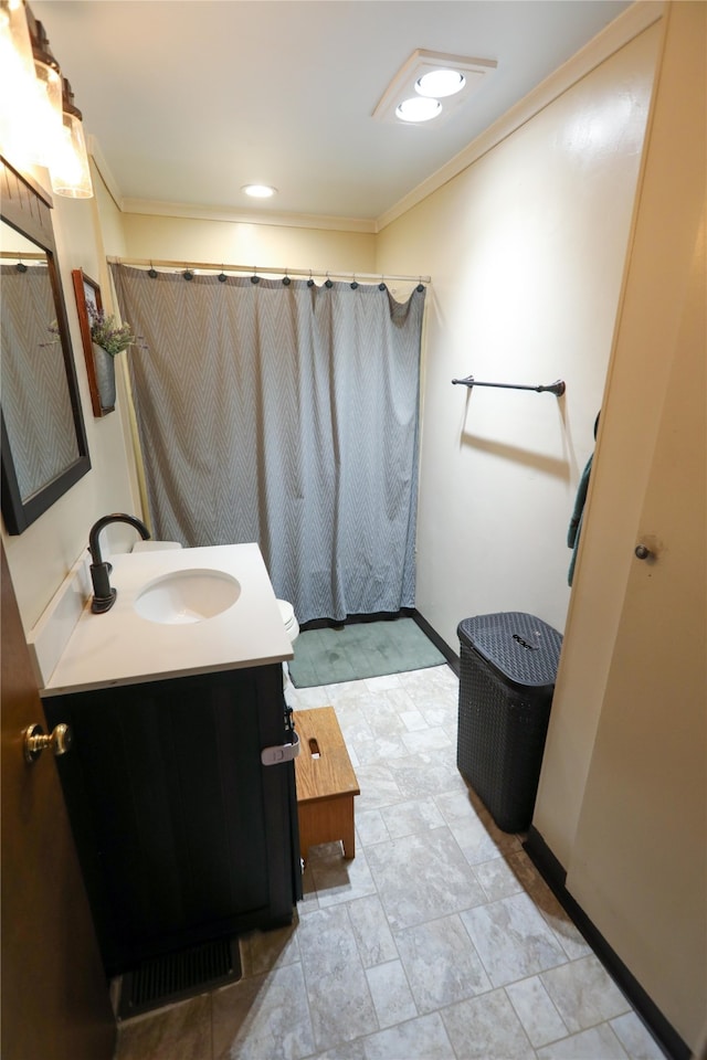 bathroom featuring ornamental molding, large vanity, and tile floors