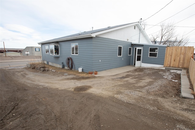 rear view of property featuring a patio area