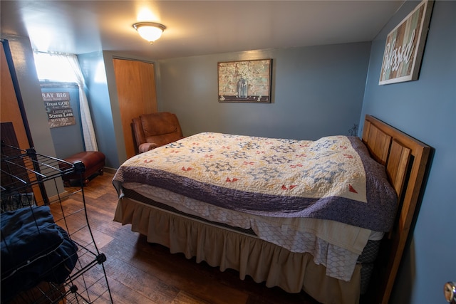 bedroom featuring dark hardwood / wood-style flooring