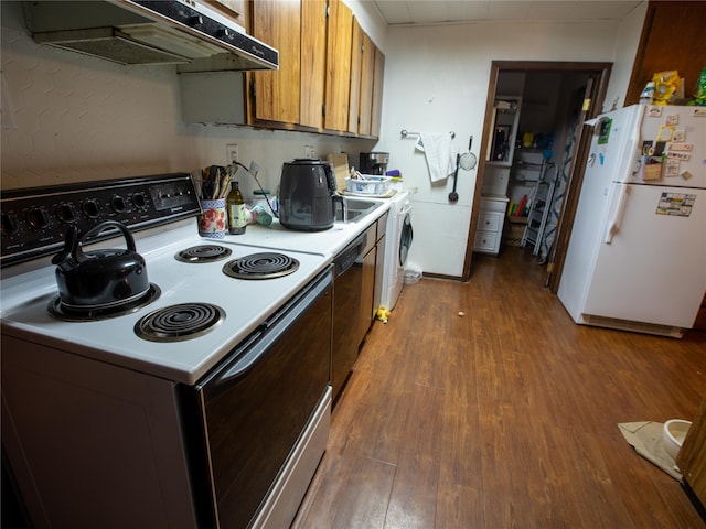 kitchen featuring hardwood / wood-style flooring, white appliances, and wall chimney exhaust hood