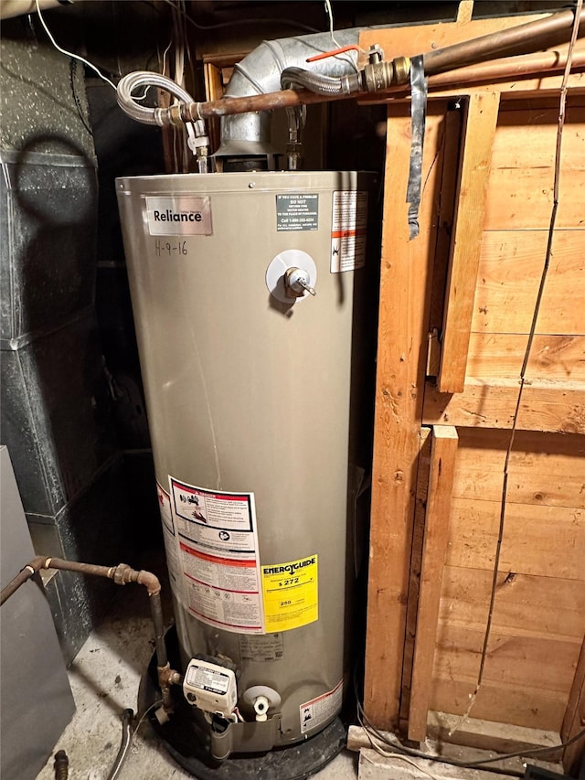 utility room with water heater