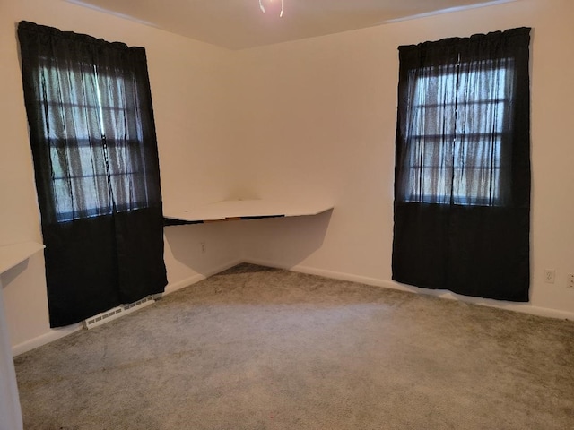 unfurnished room with carpet flooring