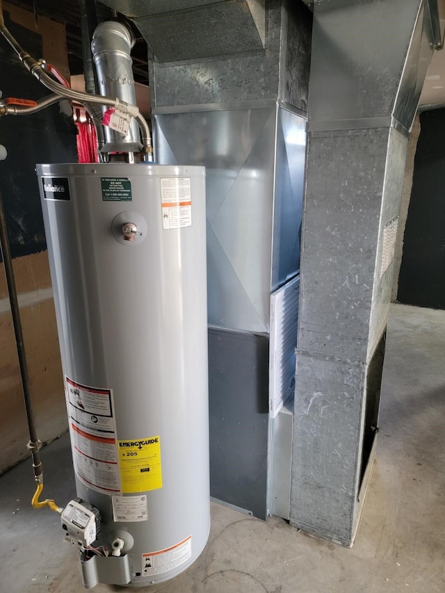 utility room featuring gas water heater