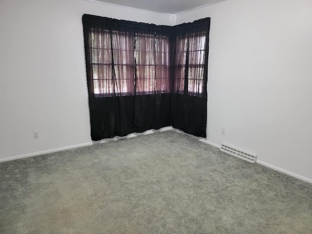 spare room featuring carpet floors