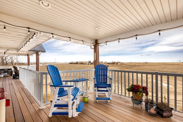 wooden deck featuring a rural view