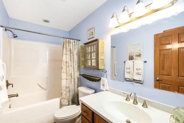 full bathroom with vanity, toilet, and shower / bath combo with shower curtain