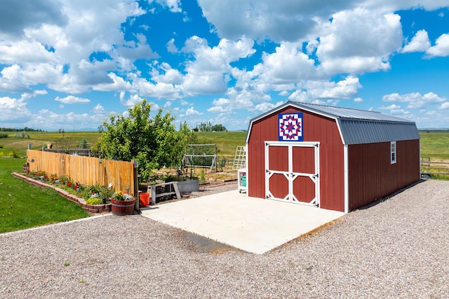 view of outbuilding featuring a rural view