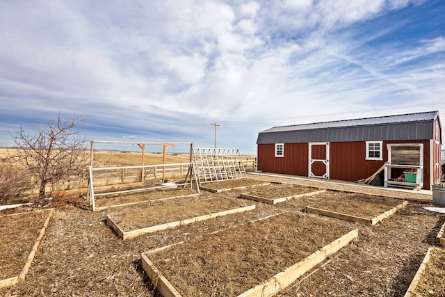 view of yard with a rural view and a storage unit