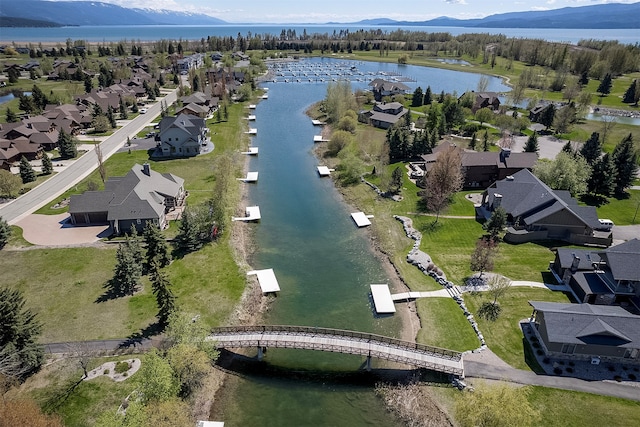 aerial view featuring a water and mountain view