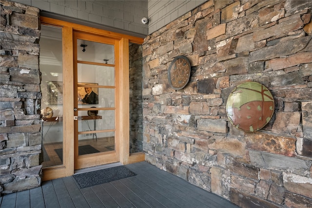 entrance to property with french doors and a wooden deck