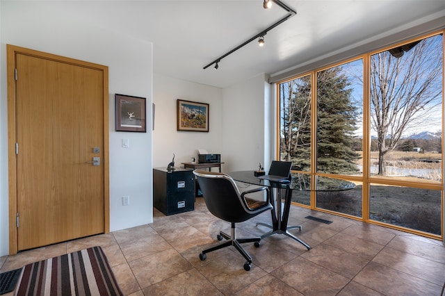 tiled office with rail lighting