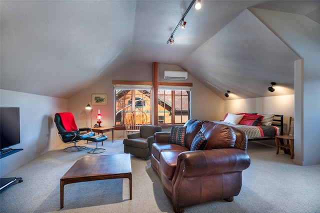 carpeted bedroom with lofted ceiling, an AC wall unit, and track lighting