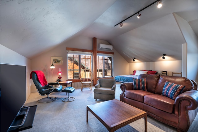 carpeted living room featuring an AC wall unit, track lighting, and vaulted ceiling