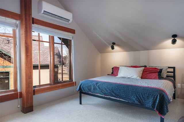 carpeted bedroom with lofted ceiling and a wall mounted air conditioner