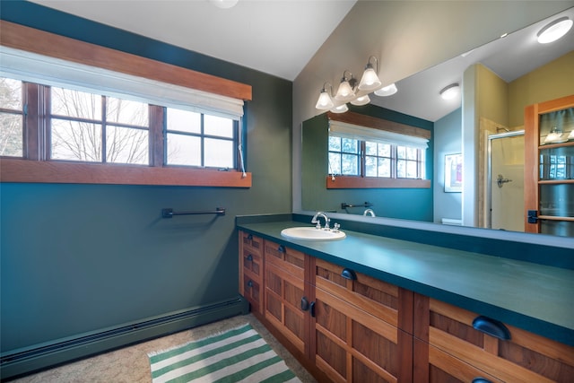 bathroom featuring a shower with door, vaulted ceiling, toilet, vanity, and baseboard heating