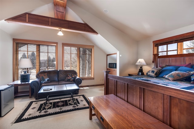 carpeted bedroom featuring lofted ceiling with beams