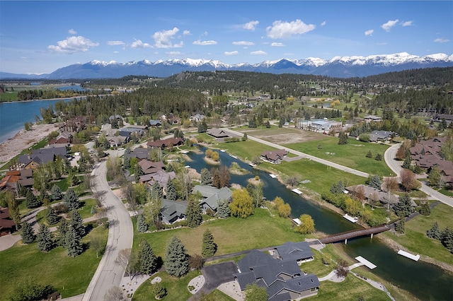 aerial view featuring a water and mountain view