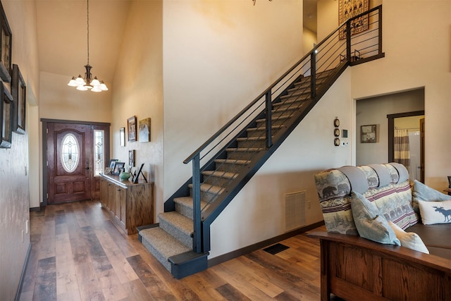 165 Jewel View Dr, Columbia Falls, MT 59912 - foyer entrance with a high ceiling, a chandelier, stairway, and wood finished floors
