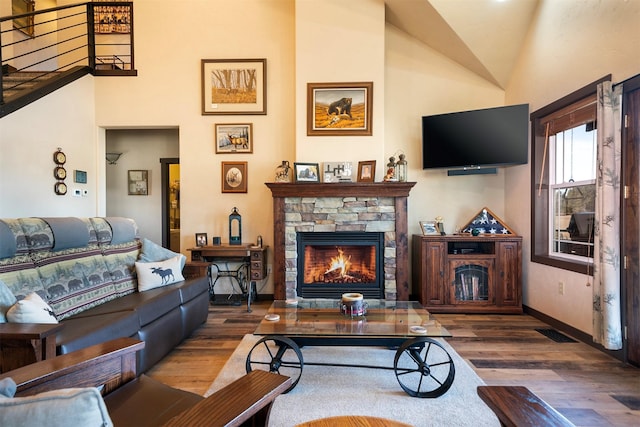 165 Jewel View Dr, Columbia Falls, MT 59912 - living room featuring a fireplace, wood finished floors, and lofted ceiling
