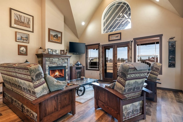 165 Jewel View Dr, Columbia Falls, MT 59912 - living area featuring a fireplace, wood finished floors, high vaulted ceiling, and recessed lighting