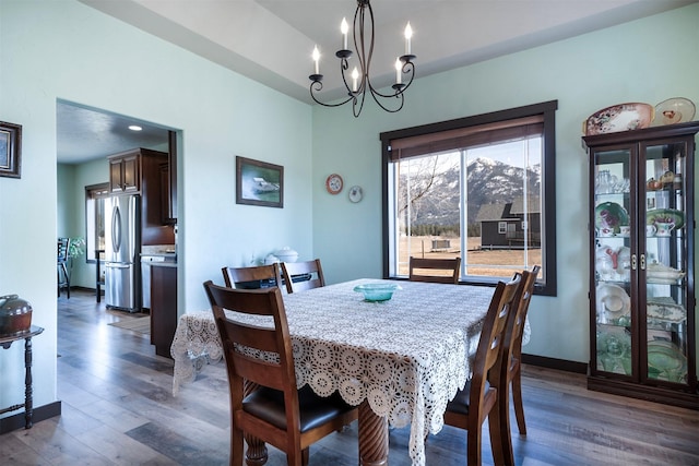 165 Jewel View Dr, Columbia Falls, MT 59912 - dining room featuring wood finished floors and a chandelier