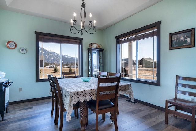 165 Jewel View Dr, Columbia Falls, MT 59912 - dining space featuring a chandelier, dark wood finished floors, and a mountain view