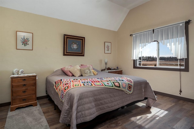 165 Jewel View Dr, Columbia Falls, MT 59912 - bedroom featuring wood finished floors and vaulted ceiling