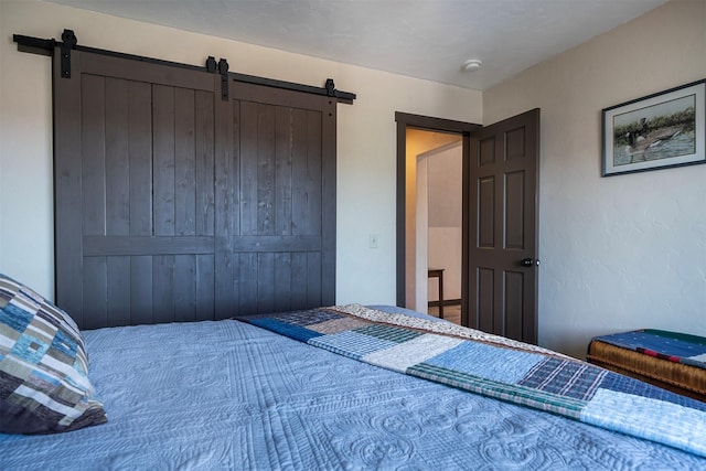 165 Jewel View Dr, Columbia Falls, MT 59912 - bedroom with a barn door