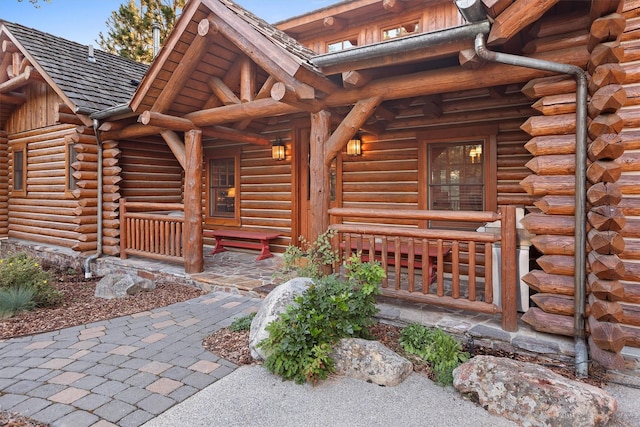 770 Pallo Trl, Hamilton, MT 59840 - doorway to property featuring log siding and a porch