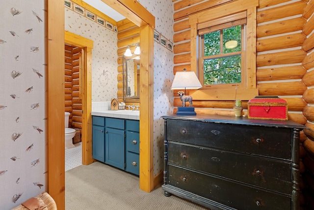 770 Pallo Trl, Hamilton, MT 59840 - full bathroom featuring rustic walls, vanity, and wallpapered walls
