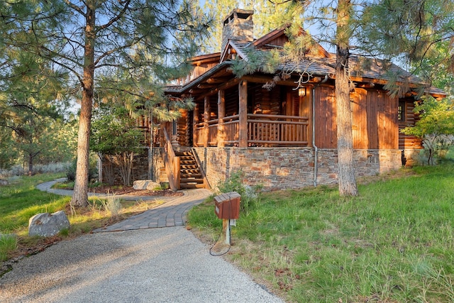 log-style house featuring a porch