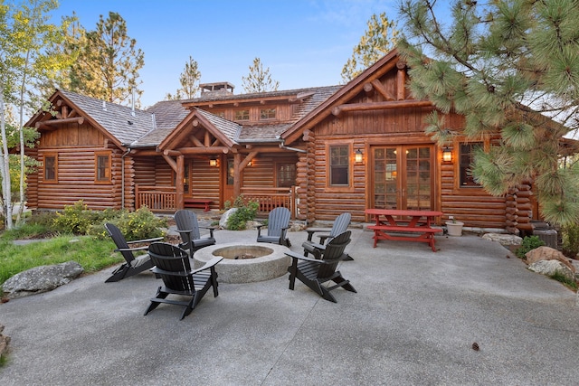 view of terrace with a fire pit