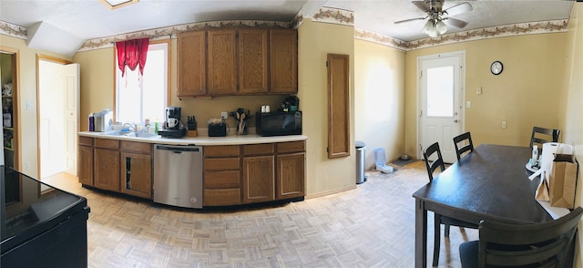 kitchen with black appliances, ceiling fan, plenty of natural light, and light parquet floors