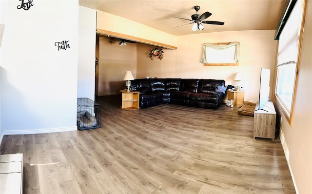 interior space with hardwood / wood-style flooring and ceiling fan