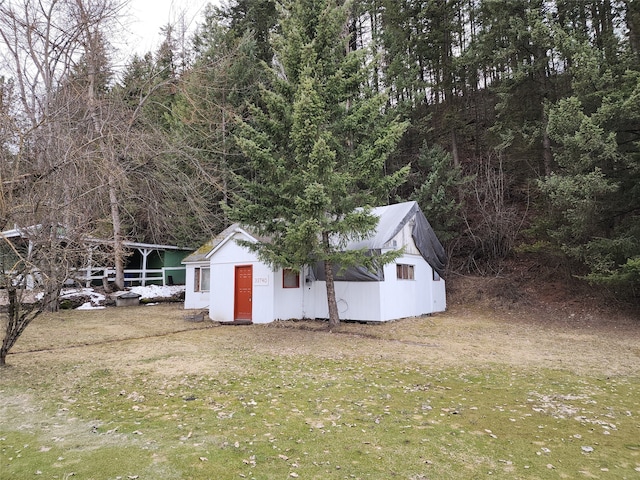 view of shed / structure with a yard