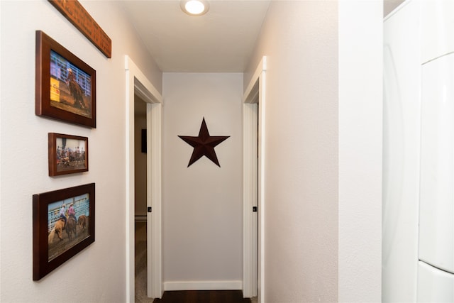 hall with dark wood-type flooring