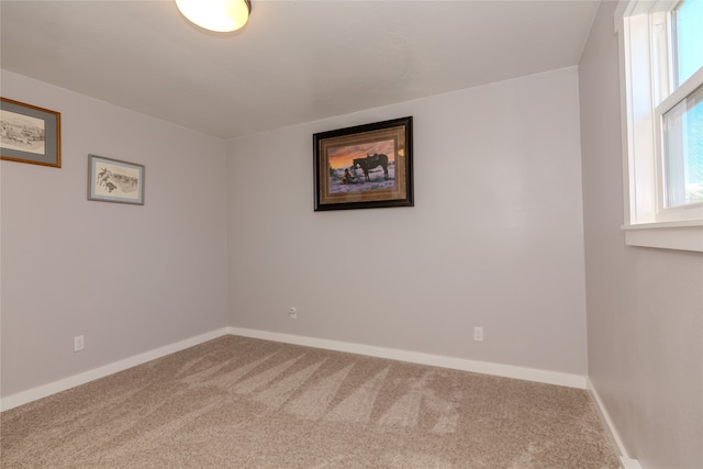 unfurnished room featuring carpet floors