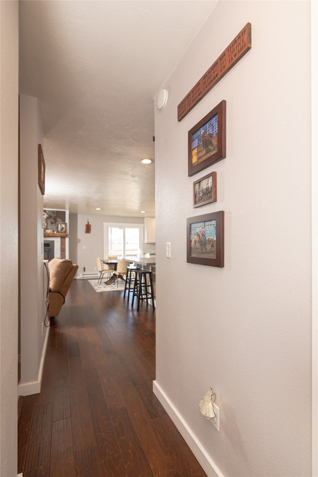 hallway with dark wood-type flooring