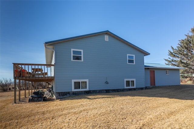 exterior space featuring a deck and a yard