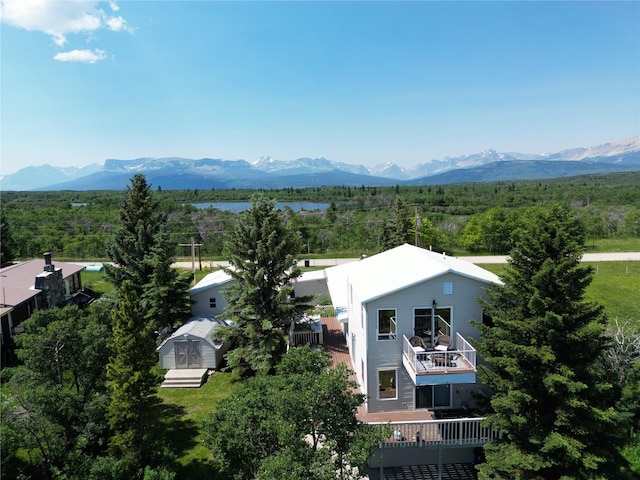 birds eye view of property with a mountain view