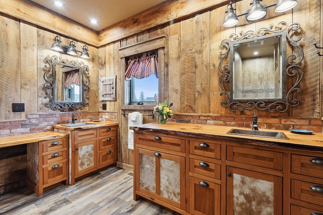 bathroom with vanity and hardwood / wood-style flooring