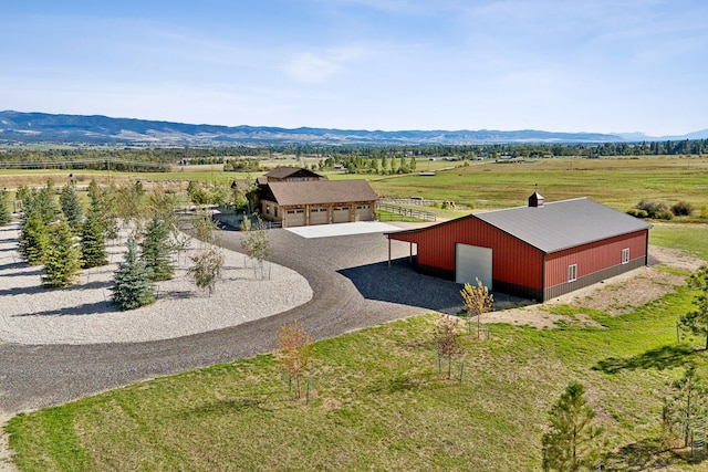 bird's eye view with a mountain view and a rural view