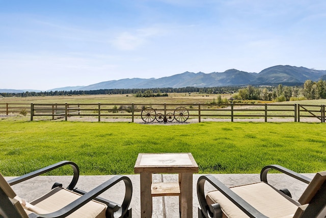 view of yard featuring a mountain view and a rural view