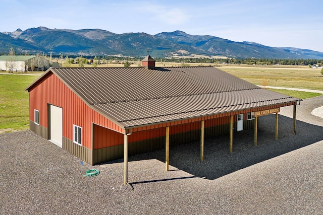 exterior space with a mountain view and a garage