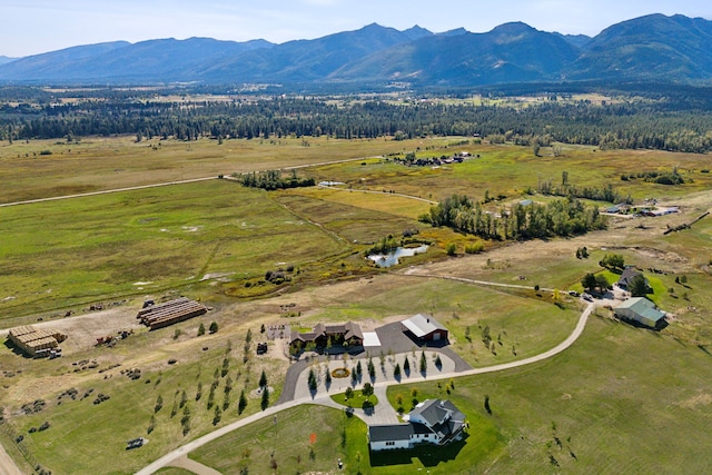 drone / aerial view with a mountain view and a rural view