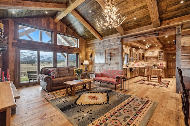 living room with wood ceiling, light hardwood / wood-style floors, beamed ceiling, and a notable chandelier