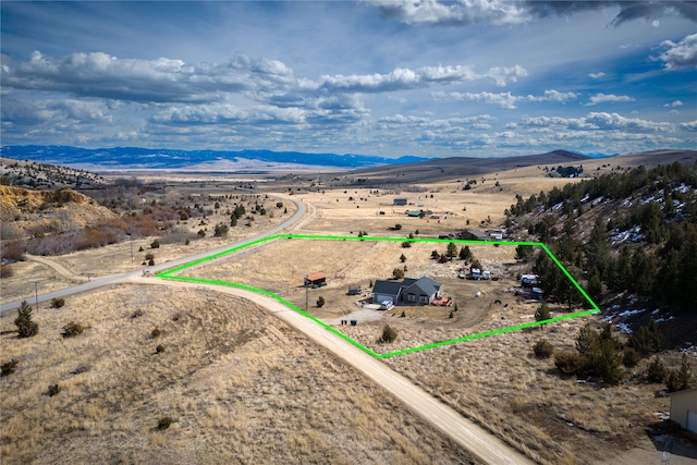 drone / aerial view featuring a mountain view